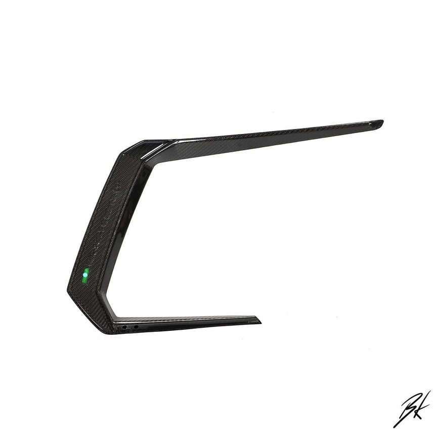 BodyKits Aerodynamics LLC carbon fiber front canard for 2018-2021 Lamborghini Urus with sleek aerodynamic design.