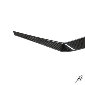 BodyKits Aerodynamics LLC dry carbon fiber canard for 2018-2021 Lamborghini Urus with a glossy weave finish.